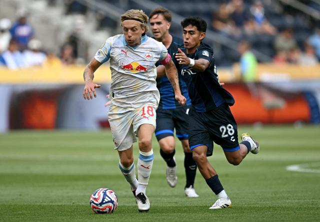 Salzburg's Danish midfielder #18 Mads Bidstrup and Pachuca's Mexican midfielder #28 Elias Montiel fight for the ball during the FIFA Club World Cup 2025 Group H football match between Mexico's Pachuca and Austria's FC Salzburg at the TQL stadium in Cincinnati on June 18, 2025. (Photo by Paul ELLIS / AFP)