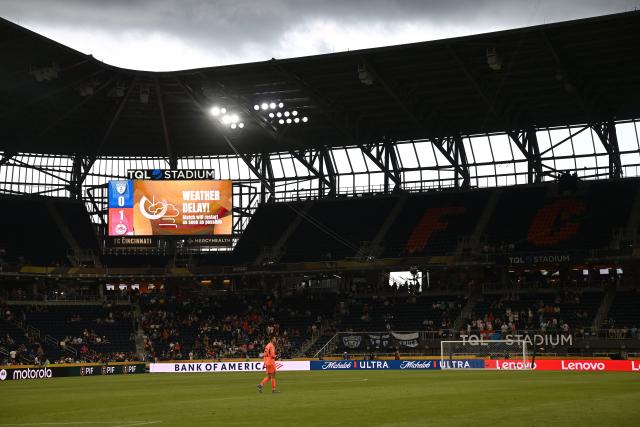 A screen announces a weather delay on the FIFA Club World Cup 2025 Group H football match between Mexico's Pachuca and Austria's FC Salzburg at the TQL stadium in Cincinnati on June 18, 2025. (Photo by Paul ELLIS / AFP)