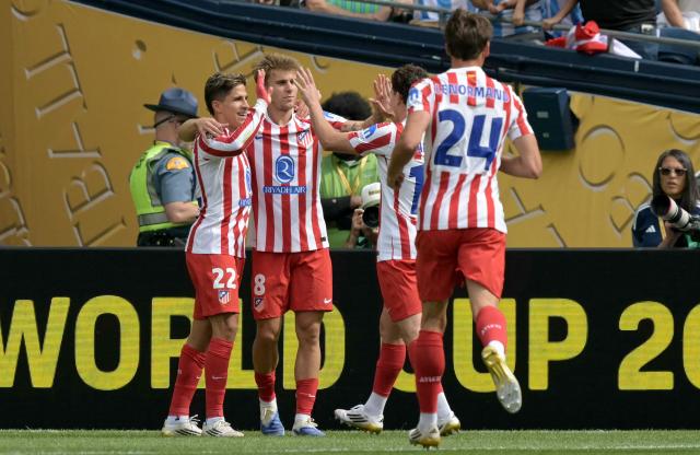 Atletico Madrid's Spanish midfielder #08 Pablo Barrios (2nd-L) celebrates with teammates after scoring his team's third goal during the FIFA Club World Cup 2025 Group B football match between US Seattle Sounders and Spain's Atletico de Madrid at the Lumen Field stadium in Seattle on June 19, 2025. (Photo by JUAN MABROMATA / AFP)