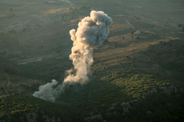 A plume of smoke rises above hills after an Israeli strike in the southern Lebanese Jezzine district on June 20, 2025. The Lebanese health ministry said an Israeli strike on south Lebanon killed one person on Juen 20, as Israel said it killed a member of Iran-backed militant group Hezbollah. (Photo by Rabih DAHER / AFP)