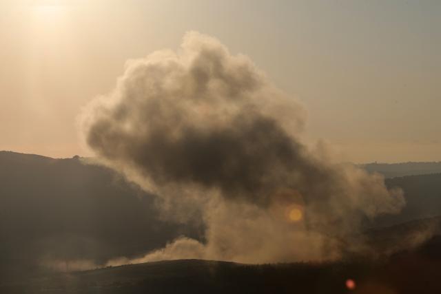 A plume of smoke rises above hills after an Israeli strike in the southern Lebanese Nabatiyeh district on June 20, 2025. The Lebanese health ministry said an Israeli strike on south Lebanon killed one person on Juen 20, as Israel said it killed a member of Iran-backed militant group Hezbollah. (Photo by Rabih DAHER / AFP)