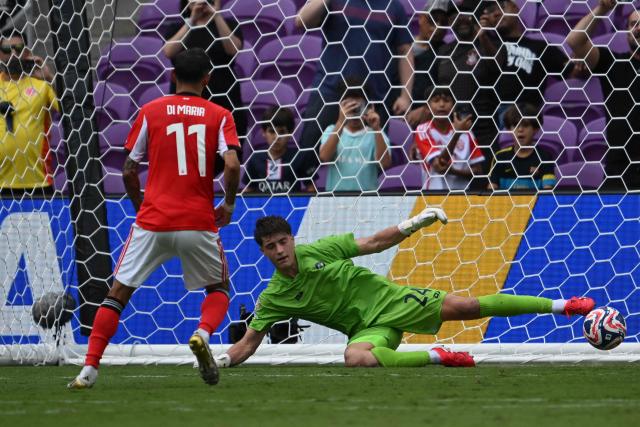 Benfica's Argentine midfielder #11 Angel Di Maria scores from the penalty spot in front of Auckland City's New Zealander goalkeeper #24 Nathan Garrow during the FIFA Club World Cup 2025 Group C football match between Portugal's Benfica and New Zealand's Auckland City at the Inter&Co stadium in Orlando on June 20, 2025. (Photo by Federico PARRA / AFP)