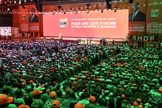 A general view of the delegates during the opening of the second ordinary congress of the Rally of Houphouetists for Democracy and Peace (RHDP) to designate the outgoing president Alassane Ouattara as its candidate for the presidential election of October 25, 2025, at the Abidjan exhibition center on June 21, 2025. Ivory Coast ruling party began a two-day congress on Saturday at the end of which it is expected to nominate incumbent President Alassane Ouattara as its candidate for the presidential election on October 25, 2025. The political climate in Ivory Coast has been tense in recent weeks following court rulings that have excluded several opposition figures from the ballot. (Photo by Sia KAMBOU / AFP)
