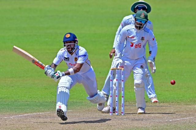 Sri Lanka's Kusal Mendis (L) plays a shot during the third day of the second Test cricket match between Sri Lanka and Bangladesh at the Sinhalese Sports Club (SSC) in Colombo on June 27, 2025. (Photo by Ishara S. KODIKARA / AFP)