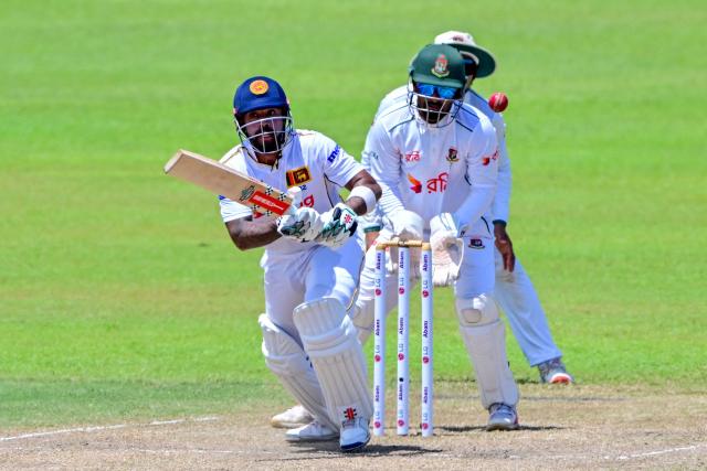 Sri Lanka's Kusal Mendis (L) plays a shot during the third day of the second Test cricket match between Sri Lanka and Bangladesh at the Sinhalese Sports Club (SSC) in Colombo on June 27, 2025. (Photo by Ishara S. KODIKARA / AFP)