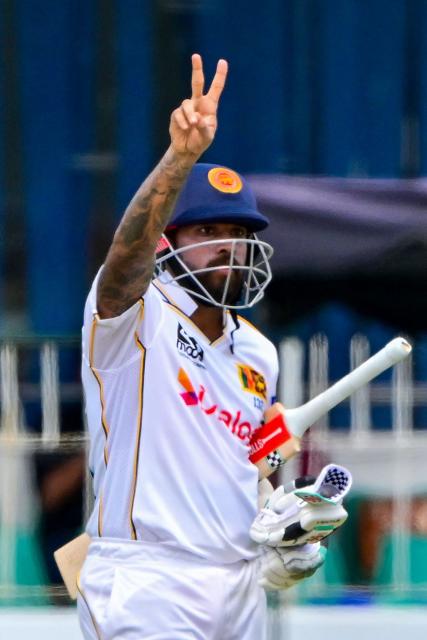 Sri Lanka's Kusal Mendis celebrates after scoring a half-century (50 runs) during the third day of the second Test cricket match between Sri Lanka and Bangladesh at the Sinhalese Sports Club (SSC) in Colombo on June 27, 2025. (Photo by Ishara S. KODIKARA / AFP)