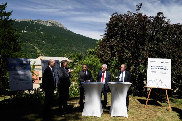 France’s Prime Minister Francois Bayrou listens to the speech of France’s Minister in charge of Transports Philippe Tabarot (2nd-L), as he takes part to the signing of a financial protocol for mobility in Briancon, southeastern France on June 27, 2025, during an interministerial comittee for the 2030 Winter Olympics and Paralympics. Franзois Bayrou gathers on June 27, 2025 in Brianзon (Hautes-Alpes) an interministerial committee dedicated to the 2030 Winter Olympics in the French Alps, with the presence of the two concerned regions and additional investments for rail and road transportation in this isolated mountainous territory. (Photo by JEFF PACHOUD / AFP)