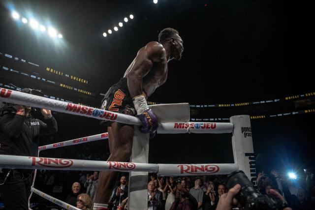 France's Christian Mbilli celebrates his victory over unseen Poland's Maciej Sulecki during their WBC Interim Super Middleweight title bout at the Videotron Centre in Quebec City, Quebec, Canada, on June 27, 2025. (Photo by ANDREJ IVANOV / AFP)