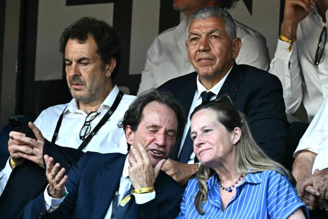 French-Moroccan former rugby player Abdelatif Benazzi (top R) looks on prior to the French Top 14 rugby union final match between the Stade Toulousain (Toulouse) and Union Bordeaux-Begles (UBB) at the Stade de France stadium in Saint-Denis, north of Paris, on June 28, 2025. (Photo by MARTIN BUREAU / AFP)
