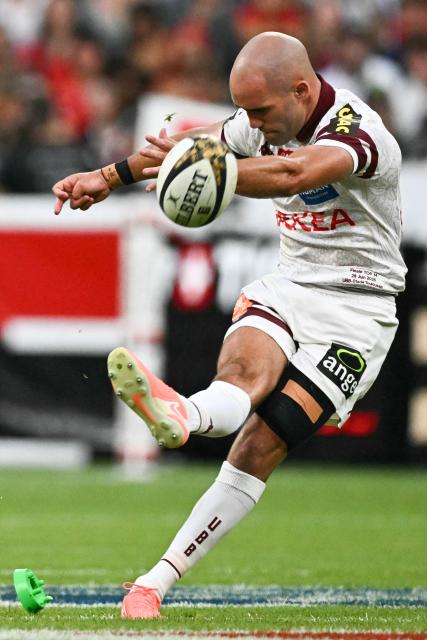 Bordeaux-Begles' French scrum-half Maxime Lucu kicks the ball for a penalty during the French Top 14 rugby union final match between the Stade Toulousain (Toulouse) and Union Bordeaux-Begles (UBB) at the Stade de France stadium in Saint-Denis, north of Paris, on June 28, 2025. (Photo by MARTIN BUREAU / AFP)