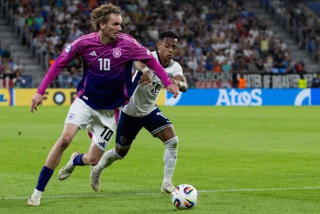 Germany's forward #10 Nick Woltemade (L) and England's forward #11 Omari Hutchinson vie for the ball during the UEFA U21 European Championship final football match between England and Germany in Bratislava, Slovakia on June 28, 2025. (Photo by TOMAS BENEDIKOVIC / AFP)