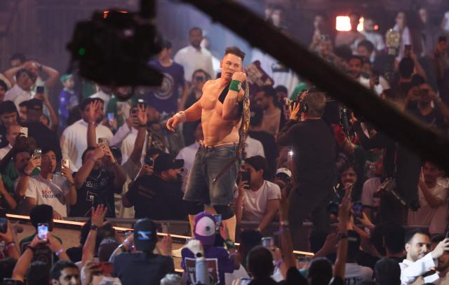 US wrestler John Cena celebrates after defeating US wrestler CM Punk fight during their match for the undisputed WWE Championship at Kingdom Arena in Riyadh on June 28, 2025. (Photo by Fayez Nureldine / AFP)
