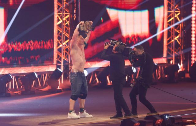 US wrestler John Cena celebrates after defeating US wrestler CM Punk fight during their match for the undisputed WWE Championship at Kingdom Arena in Riyadh on June 28, 2025. (Photo by Fayez Nureldine / AFP)