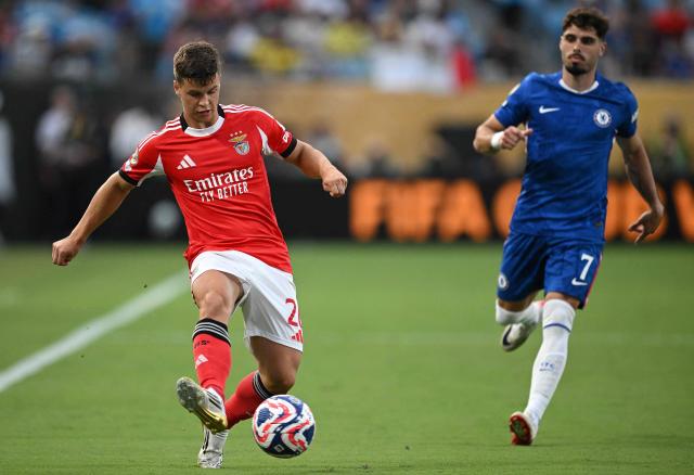 Benfica's Swedish defender #26 Samuel Dahl controls the ball next to Chelsea's Portuguese midfielder #07 Pedro Neto during the FIFA Club World Cup 2025 round of 16 football match between Portugal's Benfica and England's Chelsea at the Bank of America Stadium in Charlotte on June 28, 2025. (Photo by Federico PARRA / AFP)