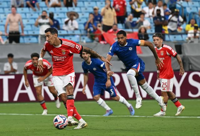 Benfica's Argentine midfielder #11 Angel Di Maria shoots from the penalty spot to score his team's first goal during the FIFA Club World Cup 2025 round of 16 football match between Portugal's Benfica and England's Chelsea at the Bank of America Stadium in Charlotte on June 28, 2025. (Photo by Paul ELLIS / AFP)