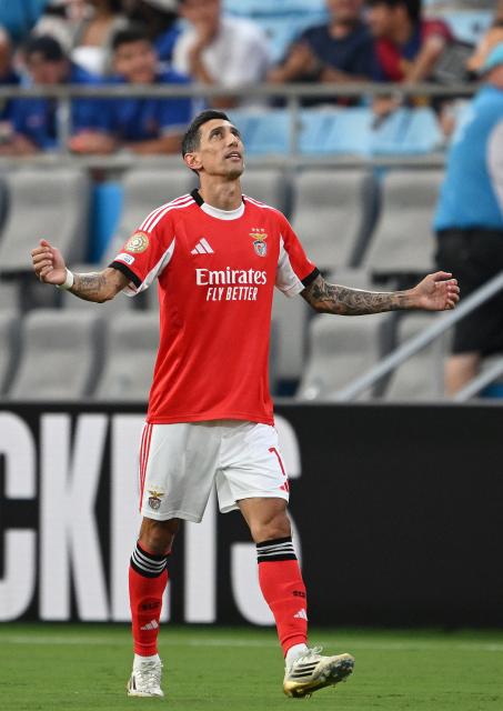 Benfica's Argentine midfielder #11 Angel Di Maria celebrates after shooting from the penalty spot to score his team's first goal during the FIFA Club World Cup 2025 round of 16 football match between Portugal's Benfica and England's Chelsea at the Bank of America Stadium in Charlotte on June 28, 2025. (Photo by Federico PARRA / AFP)
