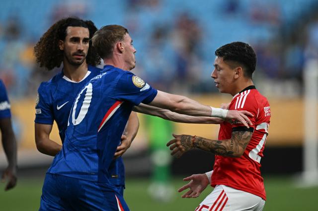 Benfica's Argentine forward #25 Gianluca Prestianni and Chelsea's English midfielder #10 Cole Palmer shuffle during the FIFA Club World Cup 2025 round of 16 football match between Portugal's Benfica and England's Chelsea at the Bank of America Stadium in Charlotte on June 28, 2025. (Photo by Paul ELLIS / AFP)