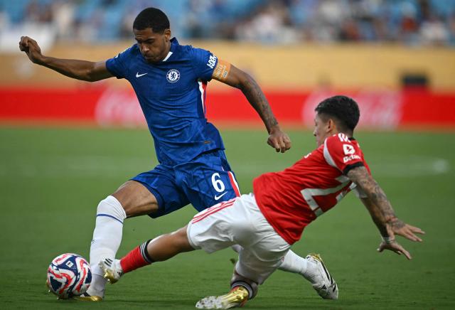 Chelsea's English defender #06 Levi Colwill and Benfica's Argentine forward #25 Gianluca Prestianni fight for the ball during the FIFA Club World Cup 2025 round of 16 football match between Portugal's Benfica and England's Chelsea at the Bank of America Stadium in Charlotte on June 28, 2025. (Photo by Paul ELLIS / AFP)