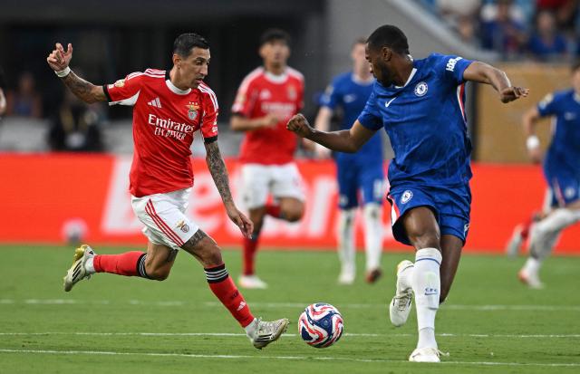 Benfica's Argentine midfielder #11 Angel Di Maria and Chelsea's English defender #04 Tosin Adarabioyo fight for the ball during the FIFA Club World Cup 2025 round of 16 football match between Portugal's Benfica and England's Chelsea at the Bank of America Stadium in Charlotte on June 28, 2025. (Photo by Federico PARRA / AFP)