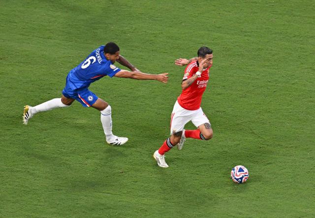 Chelsea's English defender #06 Levi Colwill and Benfica's Argentine midfielder #11 Angel Di Maria fight for the ball during the FIFA Club World Cup 2025 round of 16 football match between Portugal's Benfica and England's Chelsea at the Bank of America Stadium in Charlotte on June 28, 2025. (Photo by ANGELA WEISS / AFP)