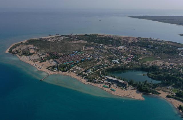 This aerial photo shows the shore of Lake Issyk-Kul, in Cholpon-Ata some 250 km from Bishkek on June 29, 2025. (Photo by VYACHESLAV OSELEDKO / AFP)