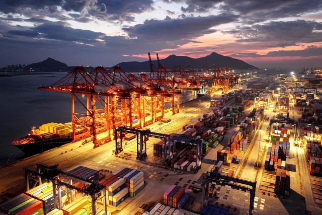 This photo shows an aerial view of containers stacked at a port in Lianyungang, in eastern China's Jiangsu province on June 29, 2025. (Photo by AFP) / China OUT