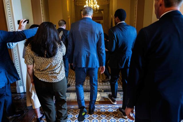 US Senate Majority Leader John Thune (C), Republican from South Dakota, is trailed by reporters as he walks back to his office from the Senate floor at the US Capitol in Washington, DC, on June 30, 2025. US senators began voting Monday on Donald Trump's flagship spending bill, as the deeply divisive package -- expected to slash social programs for the poor and add an eye-watering $3 trillion to the national debt -- entered its frenetic home stretch. Trump wants what he calls the "One Big Beautiful Bill" to extend his expiring first-term tax cuts at a cost of $4.5 trillion to the budget, boost military spending and fund his plans for unprecedented mass deportations and border security. (Photo by Jim WATSON / AFP)