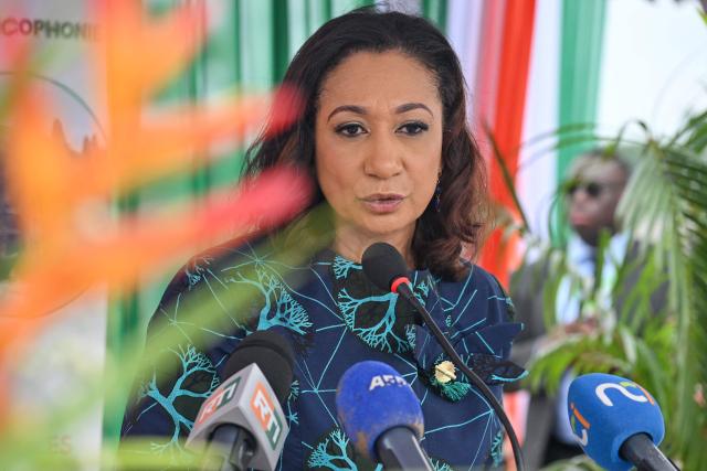 Ivorian Minister of Culture and Francophonie, Françoise Remarck speaks during the inauguration of an extension of Ivory Coast's first archaeological museum in the village of Singrobo-Ahouty near Tiassale on June 30, 2025. Ivory Coast on June 30, 2025 inaugurated a new extension of its first archaeological museum after Stone Age relics surfaced when a dam was being built in the south of the country. (Photo by Issouf SANOGO / AFP)