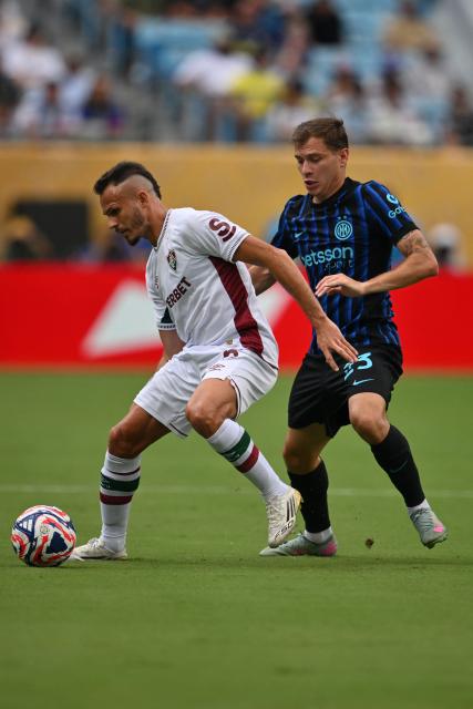 Fluminense's Brazilian defender #06 Rene and Inter Milan's Italian midfielder #23 Nicolo Barella fight for the ball during the FIFA Club World Cup 2025 round of 16 football match between Italy's Inter Milan and Brazil's Fluminense at the Bank of America Stadium in Charlotte on June 30, 2025. (Photo by ANGELA WEISS / AFP)