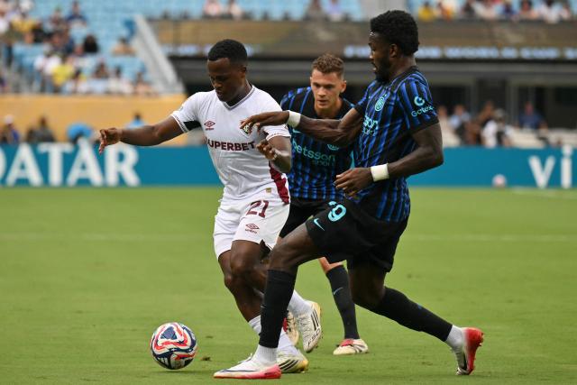 Fluminense's Colombian midfielder #21 Jhon Arias, Inter Milan's Italian midfielder #23 Nicolo Barella and Inter Milan's French forward #09 Marcus Thuram fight for the ball during the FIFA Club World Cup 2025 round of 16 football match between Italy's Inter Milan and Brazil's Fluminense at the Bank of America Stadium in Charlotte on June 30, 2025. (Photo by ANGELA WEISS / AFP)