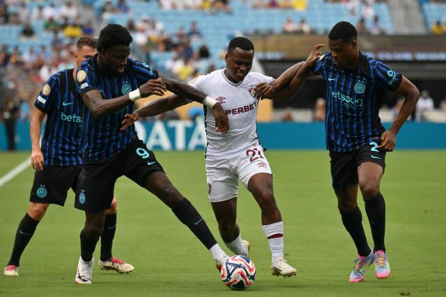 Inter Milan's French forward #09 Marcus Thuram, Fluminense's Colombian midfielder #21 Jhon Arias and Inter Milan's Dutch defender #02 Denzel Dumfries fight for the ball during the FIFA Club World Cup 2025 round of 16 football match between Italy's Inter Milan and Brazil's Fluminense at the Bank of America Stadium in Charlotte on June 30, 2025. (Photo by ANGELA WEISS / AFP)