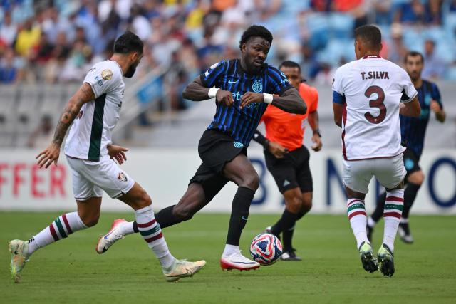 Fluminense's Argentine defender #22 Juan Pablo Freytes, Inter Milan's French forward #09 Marcus Thuram and Fluminense's Brazilian defender #03 Thiago Silva fight for the ball during the FIFA Club World Cup 2025 round of 16 football match between Italy's Inter Milan and Brazil's Fluminense at the Bank of America Stadium in Charlotte on June 30, 2025. (Photo by ANGELA WEISS / AFP)