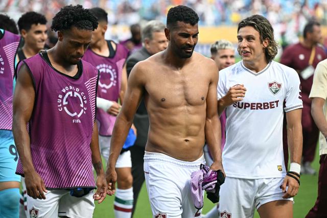 Fluminense's Colombian defender #12 Gabriel Fuentes (L), Fluminense's Brazilian midfielder #29 Thiago Santos (C) and Fluminense's Uruguayan midfielder #17 Agustin Canobbio (R) leave the pitch at the end of the FIFA Club World Cup 2025 round of 16 football match between Italy's Inter Milan and Brazil's Fluminense at the Bank of America Stadium in Charlotte on June 30, 2025. (Photo by Paul ELLIS / AFP)
