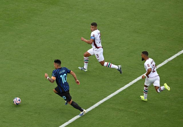 Inter Milan's Argentine forward #10 Lautaro Martinez controls the ball next to Fluminense's Brazilian defender #03 Thiago Silva and Brazilian defender #02 Samuel Xavier  during the FIFA Club World Cup 2025 round of 16 football match between Italy's Inter Milan and Brazil's Fluminense at the Bank of America Stadium in Charlotte on June 30, 2025. (Photo by Federico PARRA / AFP)