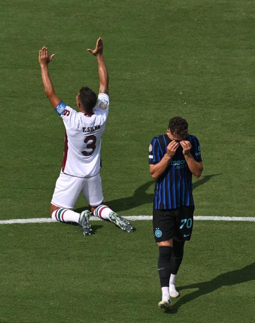 Fluminense's Brazilian defender #03 Thiago Silva and Inter Milan's Italian forward #70 Sebastiano Esposito react at the end of the FIFA Club World Cup 2025 round of 16 football match between Italy's Inter Milan and Brazil's Fluminense at the Bank of America Stadium in Charlotte on June 30, 2025. (Photo by Federico PARRA / AFP)
