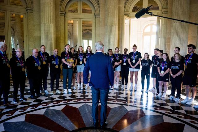 King Philippe of Belgium (C, back) speaks to the players and members of the Belgian women's basketball team at the Royal Castle in Laken, Brussels, on June 30, 2025, a day after Belgium won the 2025 FIBA Women's EuroBasket. (Photo by JASPER JACOBS / Belga / AFP) / Belgium OUT