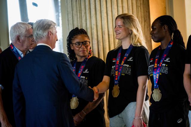 King Philippe of Belgium (L) shakes hands with the players and members of the Belgian women's basketball team at the Royal Castle in Laken, Brussels, on June 30, 2025, a day after Belgium won the 2025 FIBA Women's EuroBasket. (Photo by JASPER JACOBS / Belga / AFP) / Belgium OUT