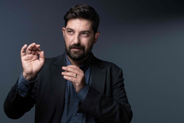 (FILES) Portuguese theatre actor, director, dramaturge and director of the Festival d'Avignon Tiago Rodrigues, poses during a photo session in Paris on September 15, 2022. Between discoveries and leading figures of the European scene, The Festival d'Avignon, which features 42 performances, including 32 world premieres for 2025 and 20 specifically in Avignon, offers "a great diversity of aesthetics," says Tiago Rodrigues, its director, in an interview with AFP. (Photo by Joël SAGET / AFP)