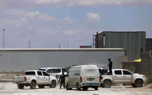 Municipal Police and Forensic Medical Service vehicles remain outside the crematorium where authorities found 381 corpses embalmed in Ciudad Juarez, Chihuahua State, Mexico, on June 30, 2025. Police have found 381 corpses piled up in a private crematorium in northern Mexico's Ciudad Juarez, the local prosecutor's office said on June 29, attributing the grisly find to negligence. (Photo by Herika Martinez / AFP)