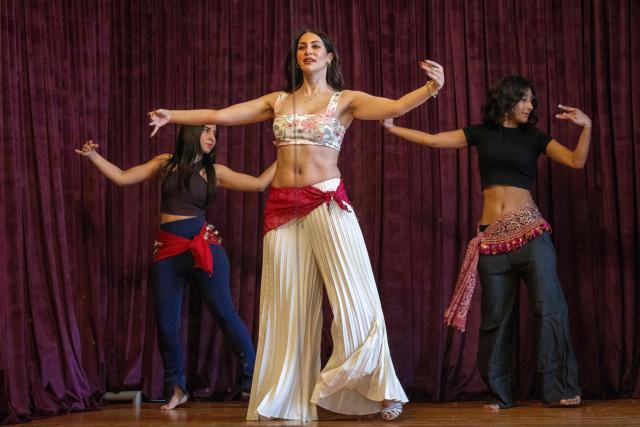 Egyptian belly-dancers Amie Sultan (C), Safaa Said (L), and Menna Emmam (C), full-time instructors at the Taksim Belly-dance Institute, take part in a rehearsal in Cairo on April 12, 2025. As belly dancing gains popularity internationally, young Egyptian performers are working to restore its reputation at home, pushing back against decades of stigma to reclaim the dance as part of their artistic heritage. Once iconic figures of Egypt's cinematic golden age, belly dancers have watched their prestige wane, their art increasingly confined to nightclubs and wedding halls. (Photo by Khaled DESOUKI / AFP)