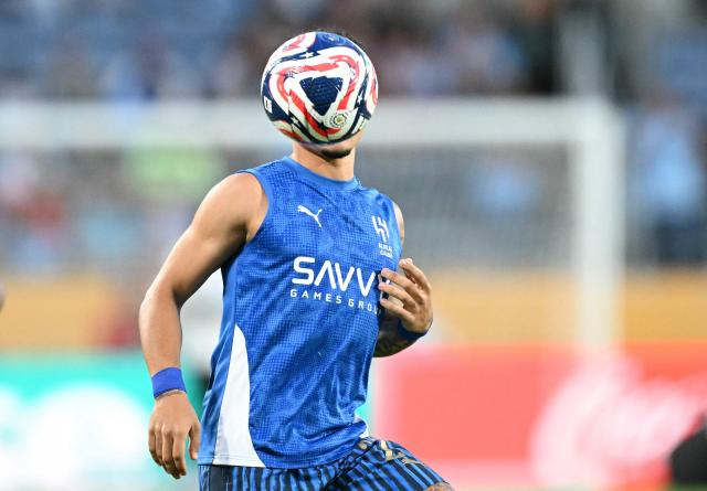 Al Hila's Brazilian midfielder #27 Kaio Cesar warms up ahead of the FIFA Club World Cup 2025 round of 16 football match between England's Manchester City and Saudi's Al-Hilal at the Camping World stadium in Orlando on June 30, 2025. (Photo by CHANDAN KHANNA / AFP)