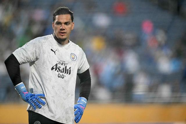 Manchester City's Brazilian goalkeeper #31 Ederson gestures during the warmup ahead of the FIFA Club World Cup 2025 round of 16 football match between England's Manchester City and Saudi's Al-Hilal at the Camping World stadium in Orlando on June 30, 2025. (Photo by PATRICIA DE MELO MOREIRA / AFP)