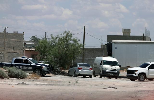 Municipal Police and Forensic Medical Service vehicles remain outside the crematorium where authorities found 381 corpses embalmed in Ciudad Juarez, Chihuahua State, Mexico, on June 30, 2025. Police have found 381 corpses piled up in a private crematorium in northern Mexico's Ciudad Juarez, the local prosecutor's office said on June 29, attributing the grisly find to negligence. (Photo by Herika Martinez / AFP)