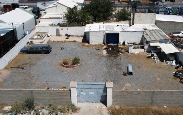 Aerial view of the crematorium where authorities found 381 embalmed corpses in Ciudad Juarez, Chihuahua State, Mexico, on June 30, 2025. Police have found 381 corpses piled up in a private crematorium in northern Mexico's Ciudad Juarez, the local prosecutor's office said on June 29, attributing the grisly find to negligence. (Photo by Herika Martinez / AFP)