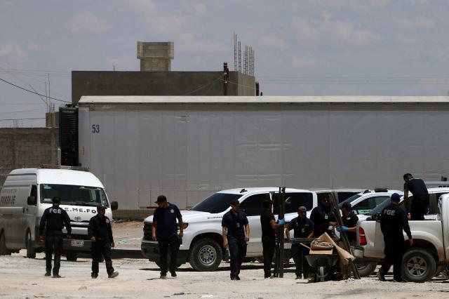 Members of the State Attorney General's Office (FGE) and the Municipal Police remain outside the crematorium where authorities found 381 corpses embalmed in Ciudad Juarez, Chihuahua State, Mexico, on June 30, 2025. Police have found 381 corpses piled up in a private crematorium in northern Mexico's Ciudad Juarez, the local prosecutor's office said on June 29, attributing the grisly find to negligence. (Photo by Herika Martinez / AFP)