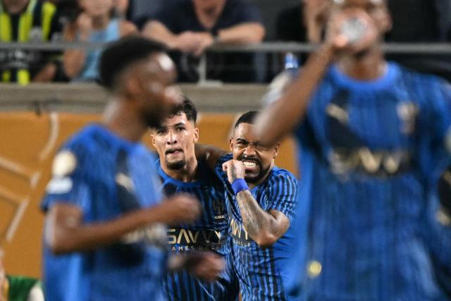 Al Hilal's Brazilian forward #77 Malcom (C-L) celebrates with teammate Brazilian forward #11 Marcos Leonardo after scoring his team's second goal during the FIFA Club World Cup 2025 round of 16 football match between England's Manchester City and Saudi's Al-Hilal at the Camping World stadium in Orlando on June 30, 2025. (Photo by PATRICIA DE MELO MOREIRA / AFP)