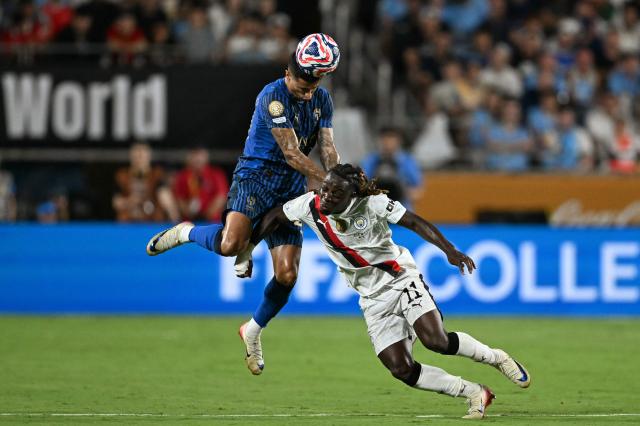 Al Hilal's Portuguese defender #20 Joao Cancelo and Manchester City's Belgian midfielder #11 Jeremy Doku fight for the ball during the FIFA Club World Cup 2025 round of 16 football match between England's Manchester City and Saudi's Al-Hilal at the Camping World stadium in Orlando on June 30, 2025. (Photo by CHANDAN KHANNA / AFP)
