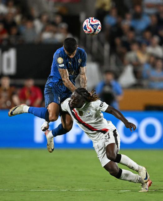 Al Hilal's Portuguese defender #20 Joao Cancelo and Manchester City's Belgian midfielder #11 Jeremy Doku fight for the ball during the FIFA Club World Cup 2025 round of 16 football match between England's Manchester City and Saudi's Al-Hilal at the Camping World stadium in Orlando on June 30, 2025. (Photo by CHANDAN KHANNA / AFP)