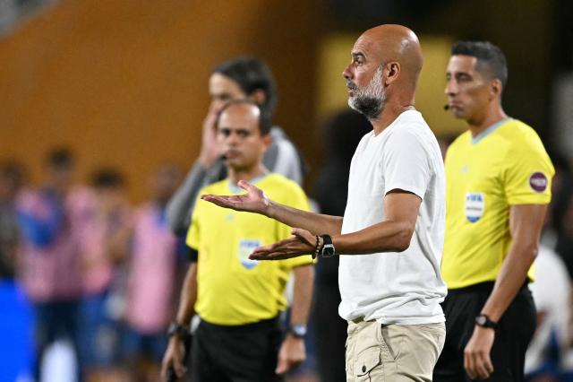 Manchester City's Spanish head coach Pep Guardiola gestures during the FIFA Club World Cup 2025 round of 16 football match between England's Manchester City and Saudi's Al-Hilal at the Camping World stadium in Orlando on June 30, 2025. (Photo by PATRICIA DE MELO MOREIRA / AFP)