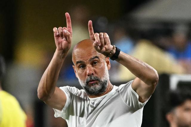 Manchester City's Spanish head coach Pep Guardiola gestures during the FIFA Club World Cup 2025 round of 16 football match between England's Manchester City and Saudi's Al-Hilal at the Camping World stadium in Orlando on June 30, 2025. (Photo by PATRICIA DE MELO MOREIRA / AFP)